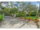 A beautiful front yard features brick pavers, an iron gate, and lush green landscaping at 111 S Battery St, Charleston, SC 29401