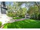 Manicured front lawn featuring brick paver accents and an iron fence at 111 S Battery St, Charleston, SC 29401