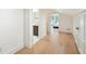 Upstairs hallway with wood floors leading to bedroom and bathroom at 111 S Battery St, Charleston, SC 29401