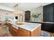 Bright kitchen with a large island, marble countertops, modern fixtures, and stainless steel appliances at 111 S Battery St, Charleston, SC 29401