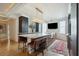 Modern kitchen with marble countertops, a large island, and stainless steel appliances and brown leather bar stools at 111 S Battery St, Charleston, SC 29401