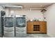 This spacious laundry room offers a sleek washer and dryer set alongside a built-in storage cabinet at 111 S Battery St, Charleston, SC 29401