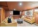 This comfy living room is illuminated by natural light and features sofas, textured rugs, and mounted TV at 111 S Battery St, Charleston, SC 29401