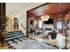 Open living room with custom chandelier, fireplace, and views to the kitchen at 111 S Battery St, Charleston, SC 29401