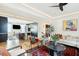 Bright, open-concept living room featuring stylish furniture and an adjacent modern kitchen and a beautiful marble coffee table at 111 S Battery St, Charleston, SC 29401