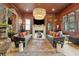 Comfortable living room featuring an ornate fireplace, large mirror and modern decor at 111 S Battery St, Charleston, SC 29401