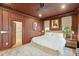 Comfortable main bedroom features an en-suite bathroom, warm tones, and hardwood floors for a soothing ambiance at 111 S Battery St, Charleston, SC 29401