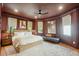 Cozy main bedroom features warm colors, hardwood floors, natural light, and a seating area at 111 S Battery St, Charleston, SC 29401