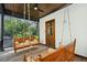 Relaxing porch with swing, ceiling fan, and lush green view at 111 S Battery St, Charleston, SC 29401