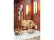 Close-up of the powder room featuring a marble countertop, elegant fixtures, and decorative accents at 111 S Battery St, Charleston, SC 29401