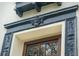 Close up on a window with detailed trim work and dark wood frame at 111 S Battery St, Charleston, SC 29401