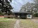 Charming brick home featuring a front porch, classic design, and inviting curb appeal at 113 Germantown Rd, Summerville, SC 29483