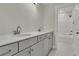 Bathroom with double sink vanity and a shower/tub combination with a white tiled surround at 117 Grange Cir, Summerville, SC 29486