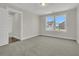 Well-lit bedroom with neutral carpet flooring and large windows at 117 Grange Cir, Summerville, SC 29486