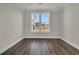 This bedroom features stunning hardwood floors and a large window at 117 Grange Cir, Summerville, SC 29486