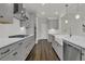 Modern kitchen featuring stainless steel appliances, white countertops, and hardwood floors at 117 Grange Cir, Summerville, SC 29486