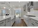 Well-equipped kitchen with stainless appliances, hardwood floors, and view of the backyard at 117 Grange Cir, Summerville, SC 29486