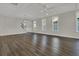 Spacious living room featuring hardwood floors, ceiling fan, and staircase access at 117 Grange Cir, Summerville, SC 29486