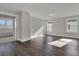 Open living room featuring hardwood floors and natural light from two windows at 117 Grange Cir, Summerville, SC 29486