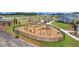 A well-maintained playground with swings, a climbing area, and a slide within a community setting at 117 Grange Cir, Summerville, SC 29486