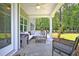 Covered back porch with outdoor furniture overlooking a spacious yard at 123 Grange Cir, Summerville, SC 29486