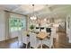 Dining room with coffered ceilings open to a kitchen and bar area at 123 Grange Cir, Summerville, SC 29486