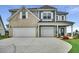 Beautiful two-story home with a two-car garage and well-manicured lawn at 123 Grange Cir, Summerville, SC 29486