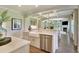 Open concept kitchen features a large farmhouse sink and stainless steel appliances at 123 Grange Cir, Summerville, SC 29486