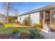 The home features a well-maintained backyard with a screened-in porch, lawn, and patio at 1236 Lakefront Dr, Charleston, SC 29412