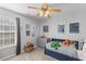 This cozy bedroom features a comfortable bed, ceiling fan, dresser and closet at 1236 Lakefront Dr, Charleston, SC 29412