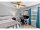 This bright bedroom features a ceiling fan, computer desk and natural light at 1236 Lakefront Dr, Charleston, SC 29412