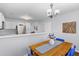 The kitchen and dining room combo features a view of the sink, stainless steel refrigerator and white cabinets at 1236 Lakefront Dr, Charleston, SC 29412