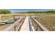 Wooden dock extends into the tranquil waterway surrounded by trees at 1236 Lakefront Dr, Charleston, SC 29412