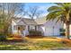 Charming single-story home with a welcoming front porch, attached two car garage and beautiful mature landscaping at 1236 Lakefront Dr, Charleston, SC 29412