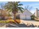 A charming home featuring a two car garage, nice landscaping and a welcoming front porch at 1236 Lakefront Dr, Charleston, SC 29412