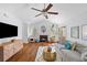 Cozy living room with hardwood floors, vaulted ceiling, decorative fireplace and sliding doors to the outdoor deck at 1236 Lakefront Dr, Charleston, SC 29412