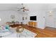 Open concept living room showcasing hardwood floors, vaulted ceilings and contemporary furniture at 1236 Lakefront Dr, Charleston, SC 29412