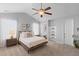 This primary bedroom is bright and features a ceiling fan and an ensuite bathroom at 1236 Lakefront Dr, Charleston, SC 29412