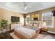 Inviting bedroom with a tray ceiling, modern decor, and ample natural light at 129 E Hartwick Ln, Goose Creek, SC 29445