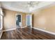 Open bedroom with wood floors features two doorways leading to the bathroom and hallway at 129 E Hartwick Ln, Goose Creek, SC 29445