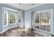 Sun-drenched dining area features large windows, a sliding glass door and modern lighting at 129 E Hartwick Ln, Goose Creek, SC 29445