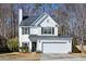 Traditional two-story home with a garage and welcoming entrance at 129 E Hartwick Ln, Goose Creek, SC 29445