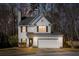 Charming two-story home features an attached two-car garage, a well-manicured lawn, and classic curb appeal at 129 E Hartwick Ln, Goose Creek, SC 29445