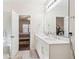 Bathroom with double sinks, hardwood floors, and a view of the bedroom at 1601 Thin Pine Dr, Johns Island, SC 29455