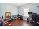 Bedroom with natural light, hardwood floors, a keyboard, and an office chair at 1601 Thin Pine Dr, Johns Island, SC 29455