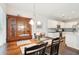 Charming dining room with hardwood floors, a large hutch, and a view into the eat-in kitchen at 1601 Thin Pine Dr, Johns Island, SC 29455