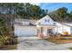 Inviting single-story home with a two-car garage and a cozy front porch at 1601 Thin Pine Dr, Johns Island, SC 29455