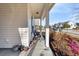 Inviting front porch with wicker chairs and a view of the neighborhood street at 1601 Thin Pine Dr, Johns Island, SC 29455