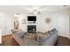 Comfortable living area with fireplace, mounted TV, and easy access to the entryway and kitchen at 1601 Thin Pine Dr, Johns Island, SC 29455