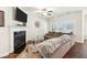 Comfortable living room with a cozy fireplace, mounted TV, and ample natural light at 1601 Thin Pine Dr, Johns Island, SC 29455
